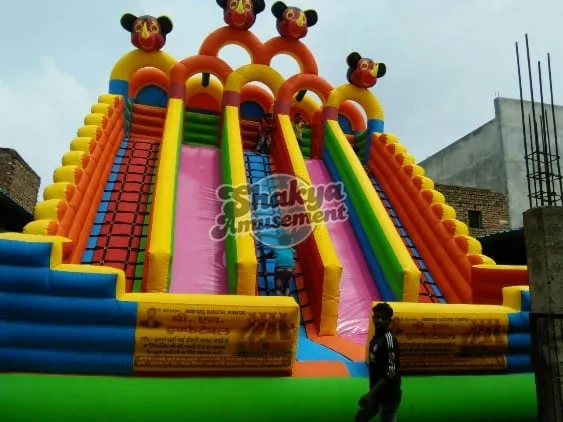22x24 Ft 5-Lane Mickey Mouse Bouncy Slide – Pink Slides & Green Base – view 1