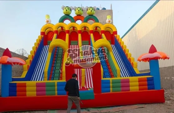 26x26 Ft 6-Lane Clown Face Bouncy Slide – Umbrella Towers & Red Base – view 1
